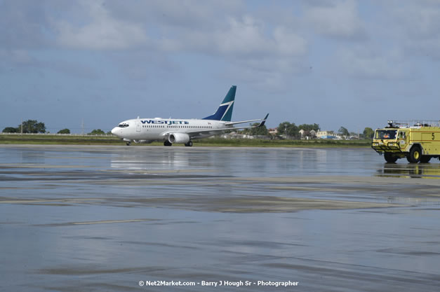 MBJ Airports Limited Welcomes WestJet Airlines - Inaugural Scheduled Service From Toronto Pearsons International Airport - Monday, December 10, 2007 - Sangster International Airport - MBJ Airports Limited, Montego Bay, Jamaica W.I. - Photographs by Net2Market.com - Barry J. Hough Sr, Photographer - Negril Travel Guide, Negril Jamaica WI - http://www.negriltravelguide.com - info@negriltravelguide.com...!