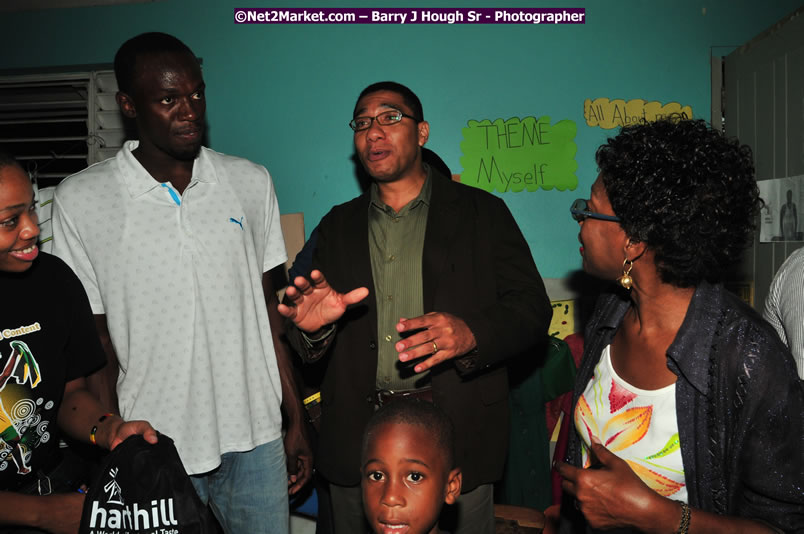 Usain Bolt of Jamaica - The Fastest Man In The World  - Usain Bolt Homecoming Celebrations - Press Conference at the Grand Bahia Principe &amp; Sherwood Content - Waldensia Primary School - Photographs by Net2Market.com - Barry J. Hough Sr. Photojournalist/Photograper - Photographs taken with a Nikon D300 - Negril Travel Guide, Negril Jamaica WI - http://www.negriltravelguide.com - info@negriltravelguide.com...!